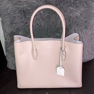 NWOT authentic Kate Spade purse with strap.